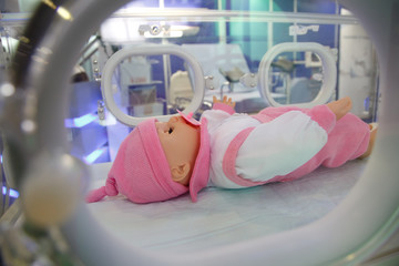 Dummy of child in medical box.
