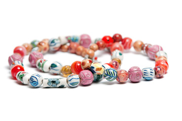 A necklace with beads in varius colors and patterns