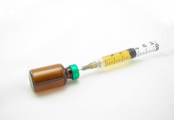 syringe and bottle of medicine