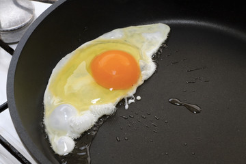 one egg  fried in a skillet