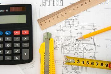 Architectural plans and blueprints in office