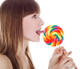 Bright picture of happy blonde with color lollipop