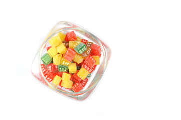 delicious sweet candies in sugar in a glass jar