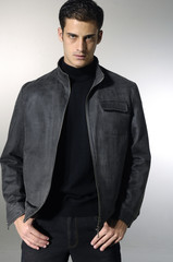 Fototapeta premium Portrait of a casual young satisfied man. Isolated on white.