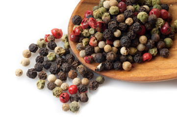 mix of pepper corns over the spoon