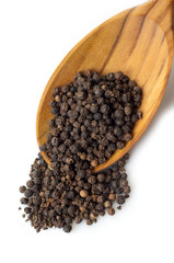 black pepper corns over the spoon