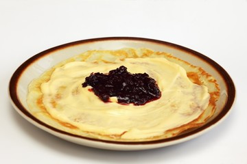 Goden pancake with cottage cheese and cherry  jam