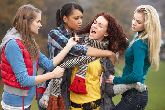 Group Of Female Teenagers Bullying Girl