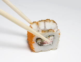 Sushi roll and chopsticks