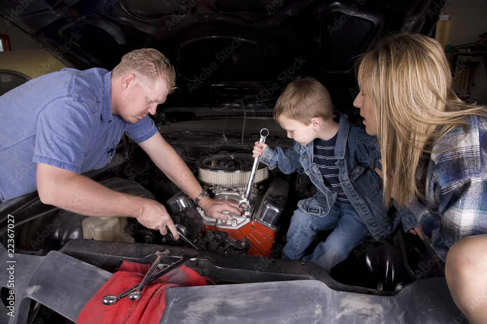 Wall mural family working on car