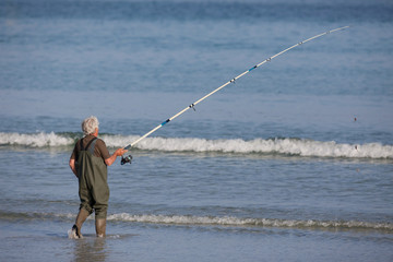 pêcheur pêche mer cuissarde lancé marée océan