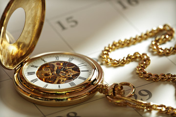Gold pocket watch and calendar