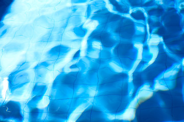 pattern of clean water in a blue swimming pool