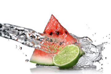 watermelon with lime and water splash isolated on white