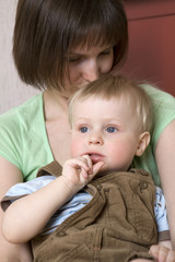 smiling mother hold her baby boy