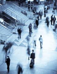 motion blurred of people walking in subway.