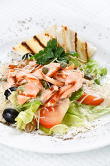 salad with grilled salmon fillet.