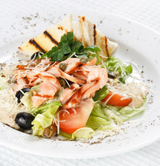 salad with grilled salmon fillet.