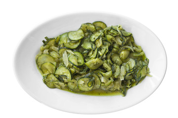 Courgettes sliced thinly and cooked with olive oil and onions.