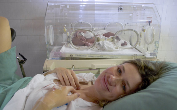 Newborn Baby With Mother After Delivery