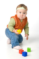 Small girl play with blocks