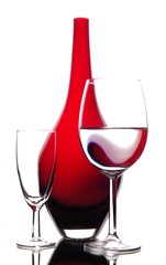 wine and red glass vase in art composition