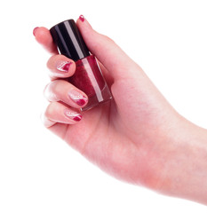 Red nail polish in human hand