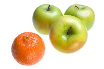 Green Apples and tangerine on white background