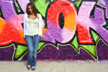 Obraz na płótnie Canvas Beautiful Colombian woman with graffiti background