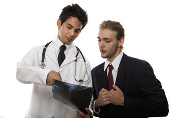 young asian doctor talking to his patient about an x-ray