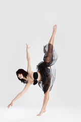 Beautiful female ballerina doing split