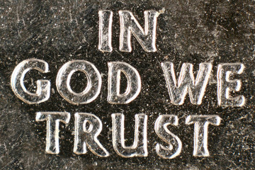 Extreme macro of a US coin's religious motto.