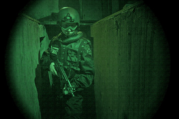 View through night vision googles- S.W.A.T. Operator © Marcin Gardychowski