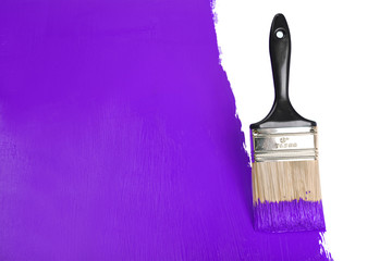 Brush Painting Wall With Purple Paint