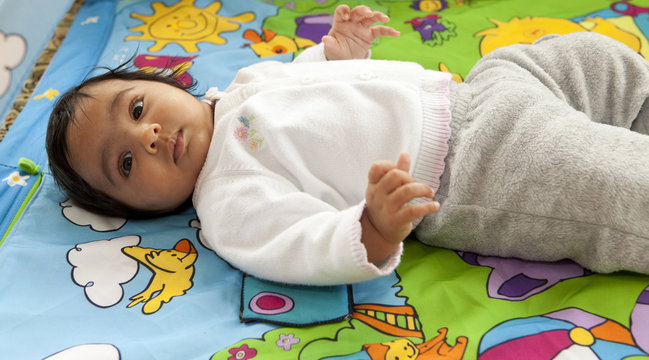 Baby Girl Playing on her Activity Mat