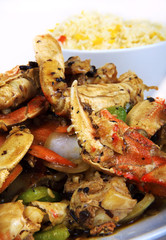 asian crab legs cooked with vegetables, served with rice