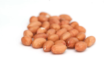 fresh roasted peanuts on a white background