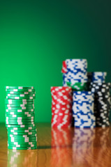 Stack of casino chips against gradient background