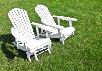 Adirondack chairs on grass