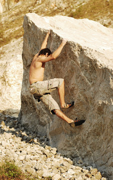 climbing a boulder