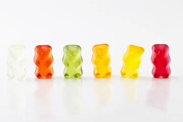 Abwaschbare Fototapete Süßigkeiten farbige Gummibaerenreihe