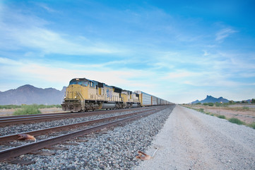 Cargo loco train rolling through Arizona desert © BCFC