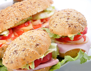 two fresh sandwiches with ham and cheese