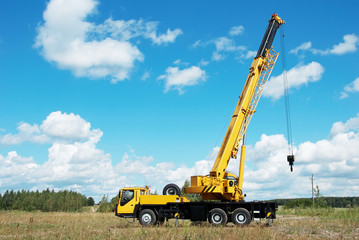mobile crane with risen boom outdoors