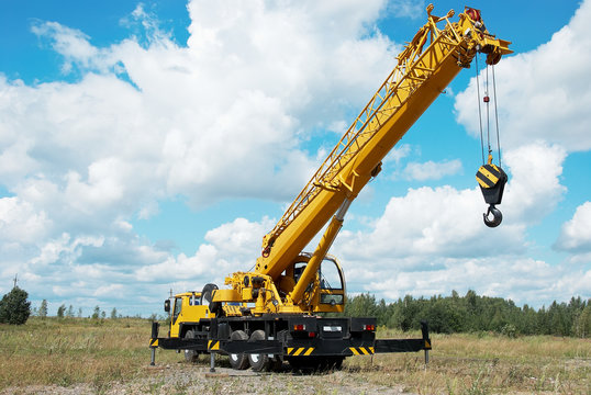 mobile crane with risen boom outdoors