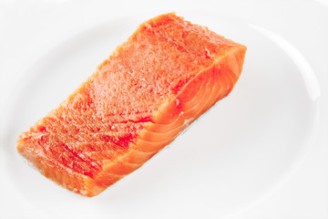 pink smoked salmon on white plate