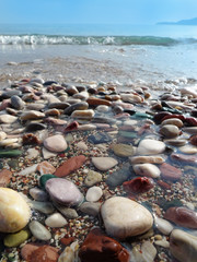 Fototapeta na wymiar colored pebbles on the beach