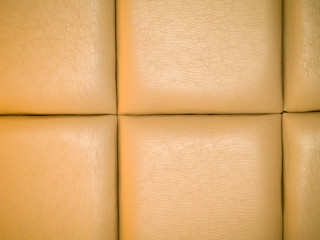 Fototapeta premium Tan Leather Upholstry Background with a Repetitive pattern