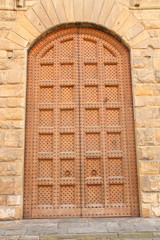 Wooden door with a stone door frame.