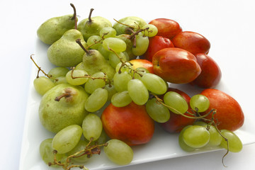 fruits on theplate on the white background